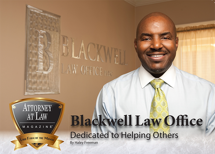 A man standing in front of the blackwell law office sign.