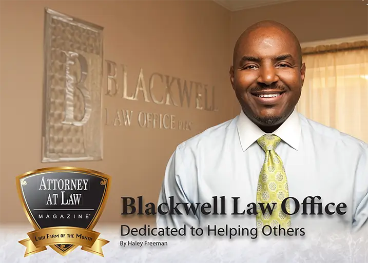 A man standing in front of the blackwell law office sign.